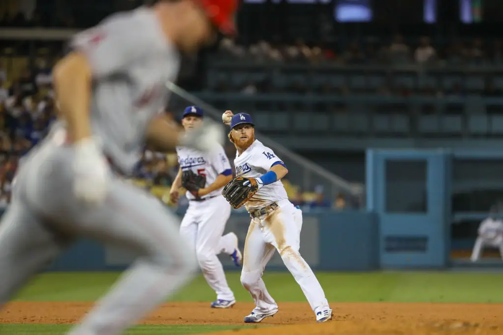 Los Angeles Dodgers third basemen Justin Turner throws the ball