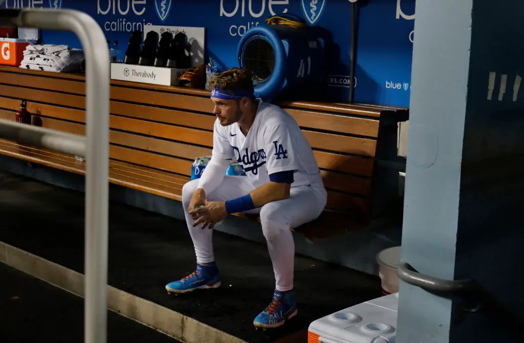 Gavin Lux of the Los Angeles Dodgers looks on from the dugout