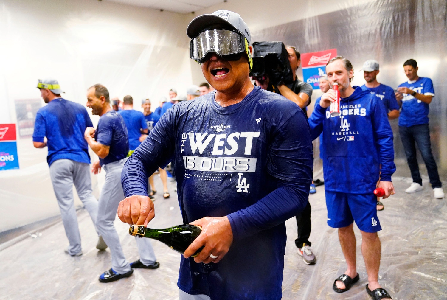 Dave Roberts, a former Dodger dons his new jersey as he is introduced as  the 10th manager of the Los Angeles Dodgers and the 28th in franchise  history, saying the post was