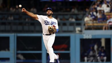 Jul 28, 2023; Los Angeles, California, USA; Los Angeles Dodgers shortstop Amed Rosario (31) throws the ball to first during the fifth inning against the Cincinnati Reds at Dodger Stadium.