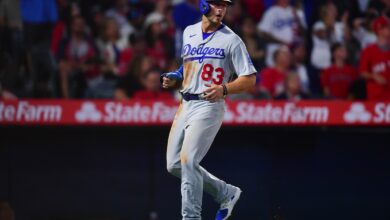 Jun 20, 2023; Anaheim, California, USA; Los Angeles Dodgers third baseman Michael Busch (83) scores a run against the Los Angeles Angels during the eighth inning at Angel Stadium.
