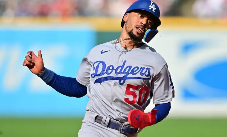 Aug 24, 2023; Cleveland, Ohio, USA; Los Angeles Dodgers right fielder Mookie Betts (50) advances to third on double hit by first baseman Freddie Freeman (5) during the third inning against the Cleveland Guardians at Progressive Field.
