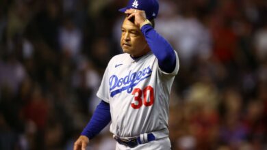 Oct 11, 2023; Phoenix, Arizona, USA; Los Angeles Dodgers manager Dave Roberts (30) reacts in the seventh inning against the Arizona Diamondbacks for game three of the NLDS for the 2023 MLB playoffs at Chase Field.