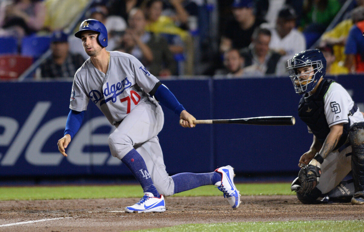 Former Los Angeles Dodgers outfielder Tim Locastro hitting a single against the San Diego Padres in 2018.