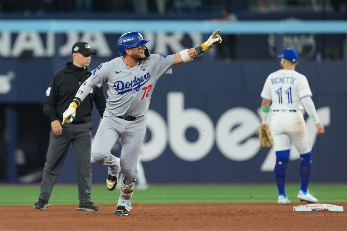 Los Angeles Dodgers infielder Miguel Rojas celebrates a home run in the ninth inning of Game 7 of the World Series.