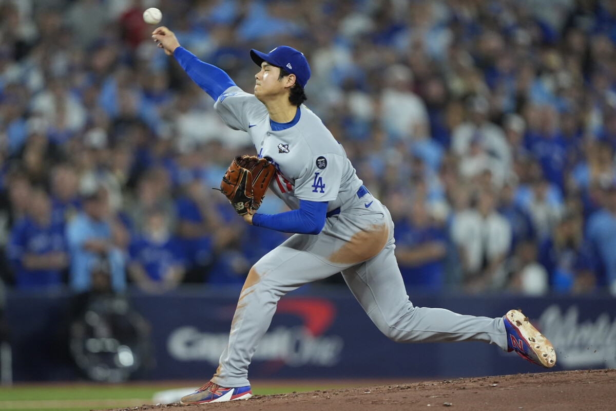 Los Angeles Dodgers two-way player Shohei Ohtani (17) pitches against the Toronto Blue Jays in the second inning during game seven of the 2025 MLB World Series at Rogers Centre.