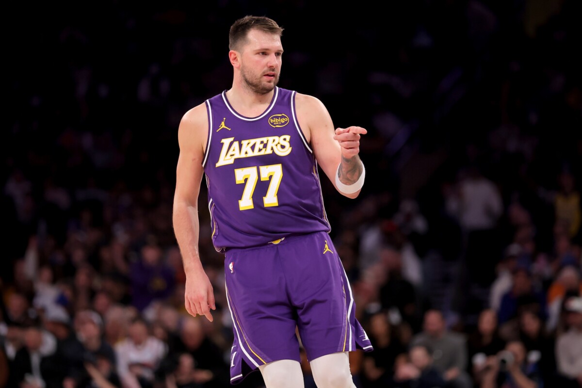 Los Angeles Lakers guard Luka Doncic (77) points in the direction of Knicks fan Spike Lee (not pictured) after a three point shot against the New York Knicks during the third quarter at Madison Square Garden on Feb 1, 2026.