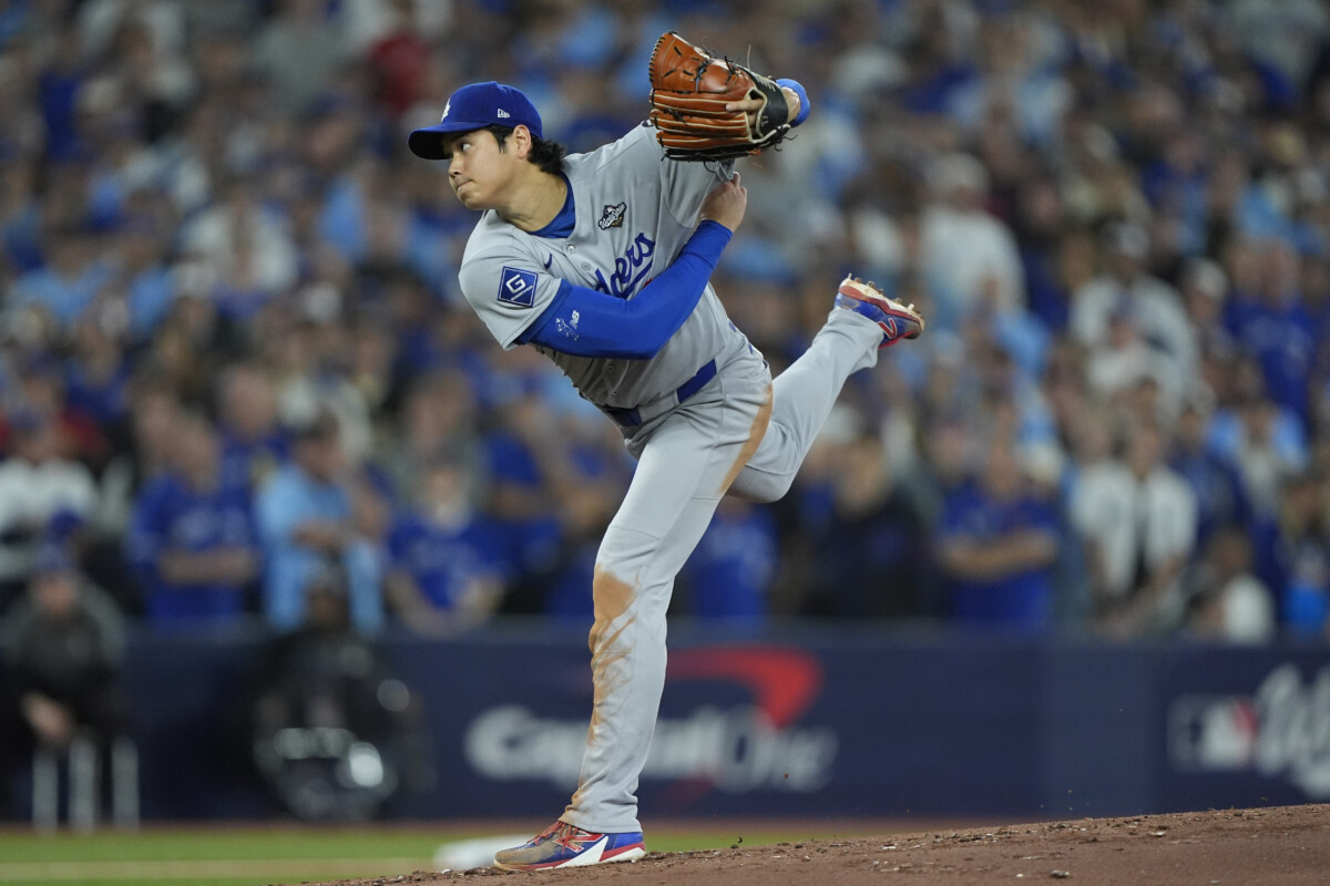Nov 1, 2025; Toronto, Ontario, CAN; Los Angeles Dodgers two-way player Shohei Ohtani (17) pitches against the Toronto Blue Jays in the second inning during game seven of the 2025 MLB World Series at Rogers Centre. Mandatory Credit: John E. Sokolowski-Imagn Images