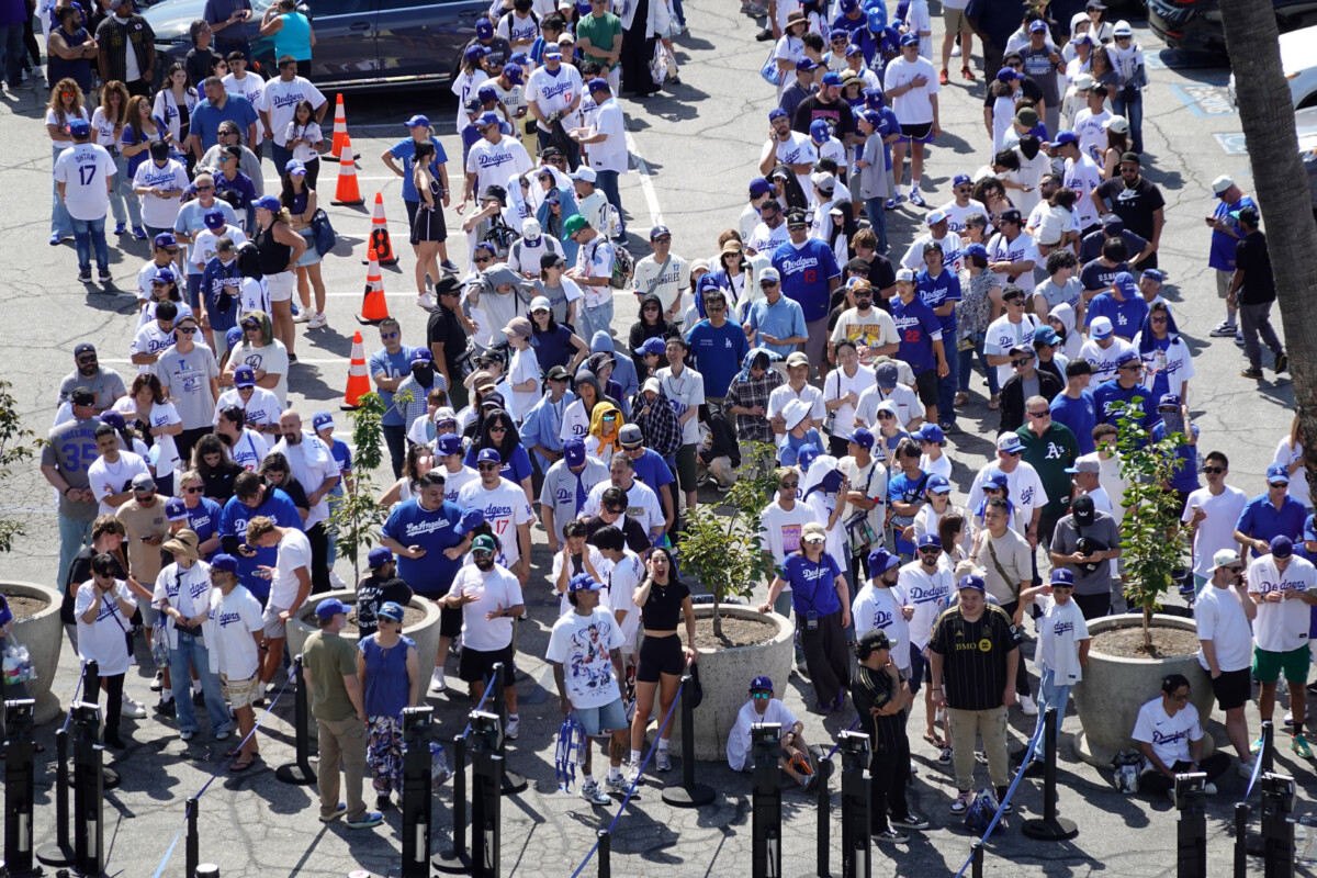 Aug 27, 2025; Los Angeles, California, USA; Fans wait in line to receive a bobblehead of Los Angeles Dodgers player Shohei Ohtani before the game against the Cincinnati Reds at Dodger Stadium. Mandatory Credit: Kirby Lee-Imagn Images
