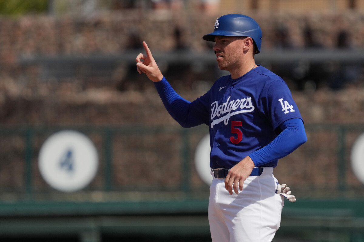 Los Angeles Dodgers first baseman Freddie Freeman (5) reacts after running to second base against the Milwaukee Brewers in the third inning at Camelback Ranch-Glendale.