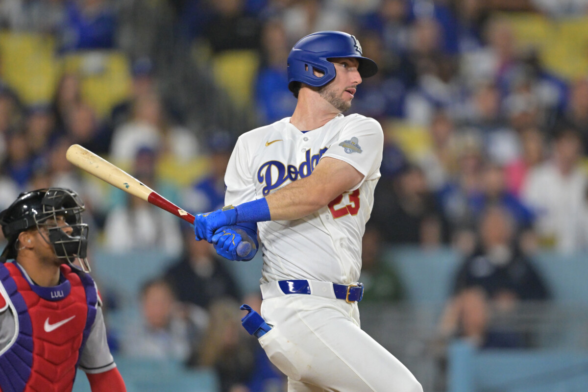 Mar 27, 2026; Los Angeles, California, USA; Los Angeles Dodgers right fielder Kyle Tucker (23) hits an RBI single against the Arizona Diamondbacks in the eighth inning at Dodger Stadium. Mandatory Credit: Jayne Kamin-Oncea-Imagn Images