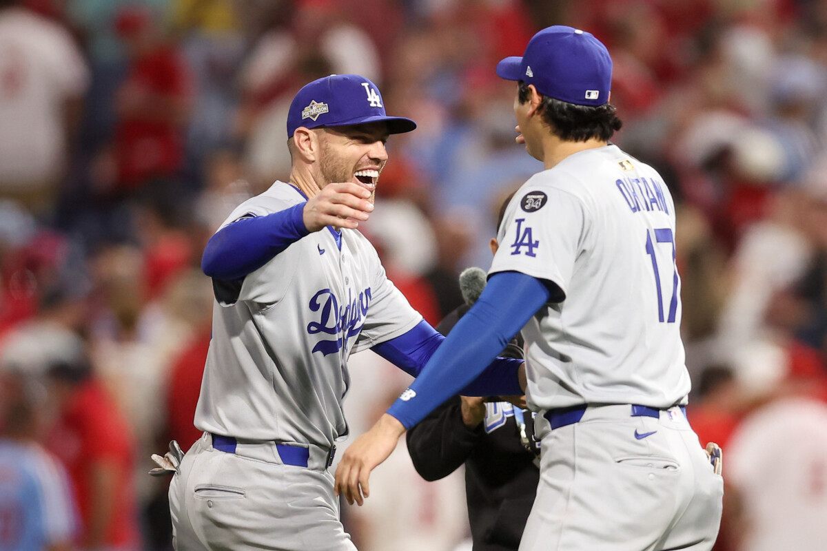 Oct 6, 2025; Philadelphia, Pennsylvania, USA; Los Angeles Dodgers first baseman Freddie Freeman (5) and designated hitter Shohei Ohtani (17) celebrate after defeating the Philadelphia Phillies in game two of the NLDS round for the 2025 MLB playoffs at Citizens Bank Park. Mandatory Credit: Bill Streicher-Imagn Images