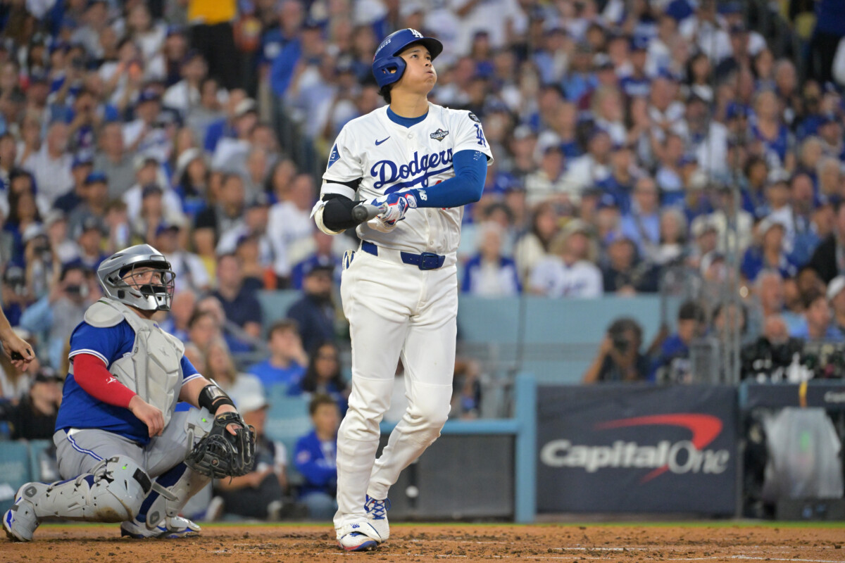 Oct 27, 2025; Los Angeles, California, USA; Los Angeles Dodgers two-way player Shohei Ohtani (17) hits a solo home run against the Toronto Blue Jays in the third inning during game three of the 2025 MLB World Series at Dodger Stadium. Mandatory Credit: Jayne Kamin-Oncea-Imagn Images
