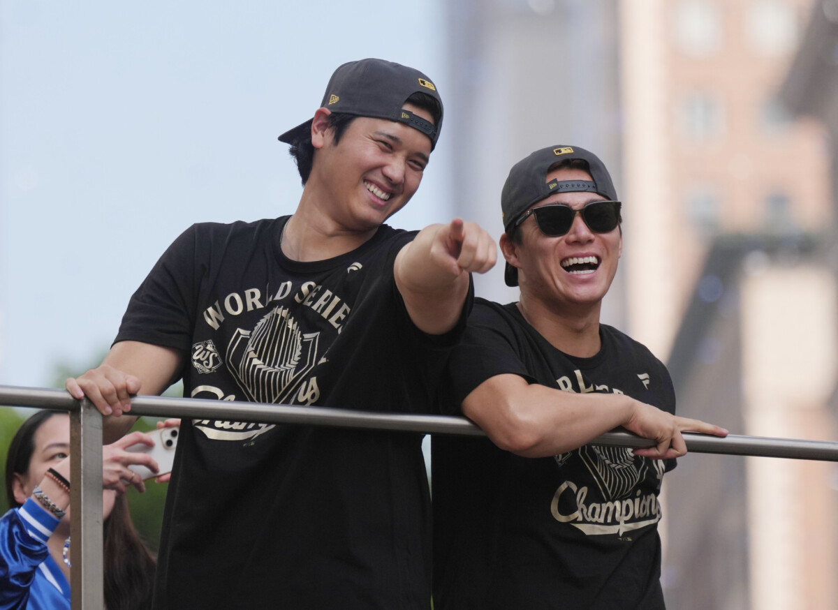 Nov 3, 2025; Los Angeles, CA, USA; Los Angeles Dodgers two-way player Shohei Ohtani (17) and pitcher Yoshinobu Yamamoto (18) during the World Series championship parade and celebration. Mandatory Credit: Kirby Lee-Imagn Images