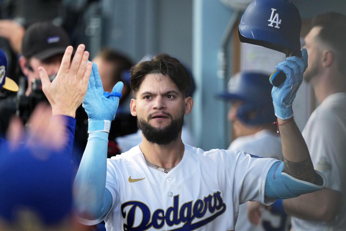 Mar 26, 2026; Los Angeles, California, USA; Los Angeles Dodgers outfielder Andy Pages (44) shakes hands with teammates in the dugout after hitting a three run home run against Arizona Diamondbacks starting pitcher Zac Gallen (not pictured) during the fifth inning at Dodger Stadium. Mandatory Credit: Kirby Lee-Imagn Images