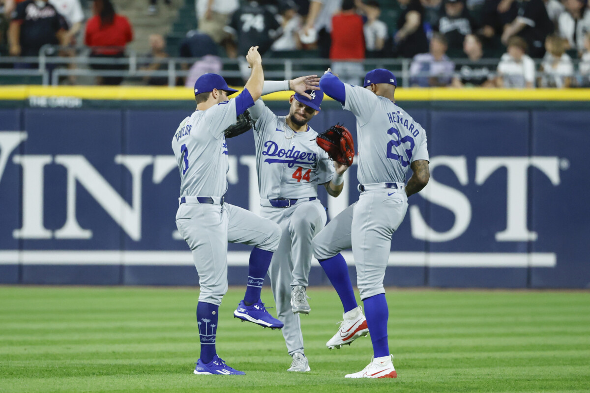 Jun 25, 2024; Chicago, Illinois, USA; Los Angeles Dodgers outfielder Chris Taylor (3), outfielder Andy Pages (44), and outfielder Jason Heyward (23) celebrate after defeating the Chicago White Sox at Guaranteed Rate Field. Mandatory Credit: Kamil Krzaczynski-USA TODAY Sports