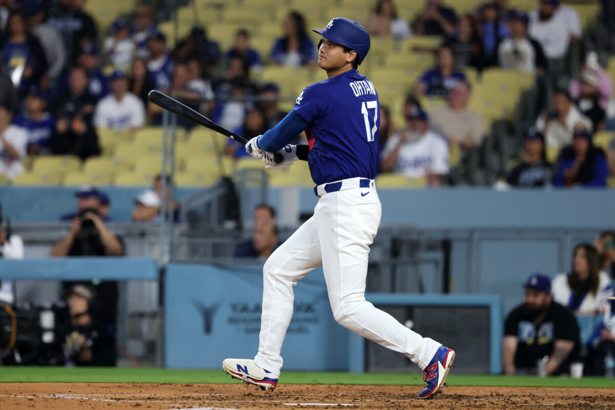 Mar 23, 2026; Los Angeles, California, USA; Los Angeles Dodgers designated hitter Shohei Ohtani (17) hits a double during the third inning against the Los Angeles Angels at Dodger Stadium. Mandatory Credit: Kiyoshi Mio-Imagn Images