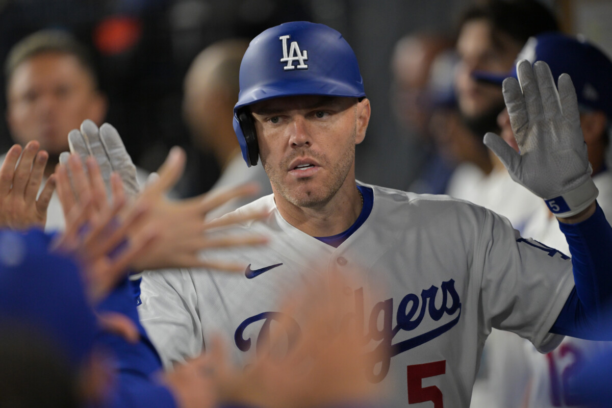 Apr 1, 2026; Los Angeles, California, USA; Los Angeles Dodgers first baseman Freddie Freeman (5) is greeted in the dugout after a solo home run in the ninth inning against the Cleveland Guardians at Dodger Stadium. Mandatory Credit: Jayne Kamin-Oncea-Imagn Images