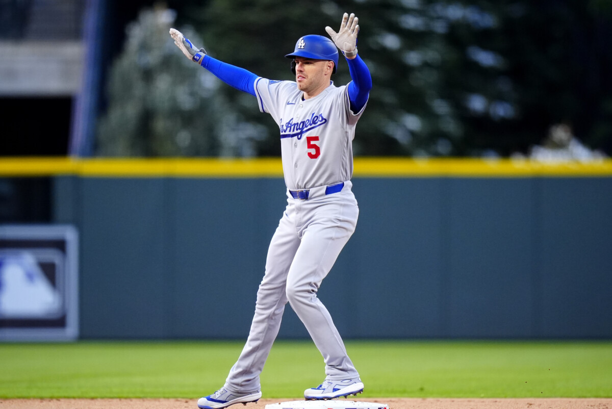 Apr 17, 2026; Denver, Colorado, USA; Los Angeles Dodgers first baseman Freddie Freeman (5) dances on second base after his double in the first inning against the Colorado Rockies at Coors Field. Mandatory Credit: Ron Chenoy-Imagn Images