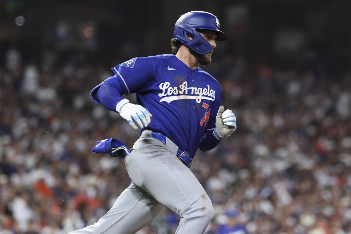 May 4, 2026; Houston, Texas, USA; Los Angeles Dodgers second baseman Alex Freeland (76) runs to first base on a single during the seventh inning against the Houston Astros at Daikin Park. Mandatory Credit: Troy Taormina-Imagn Images