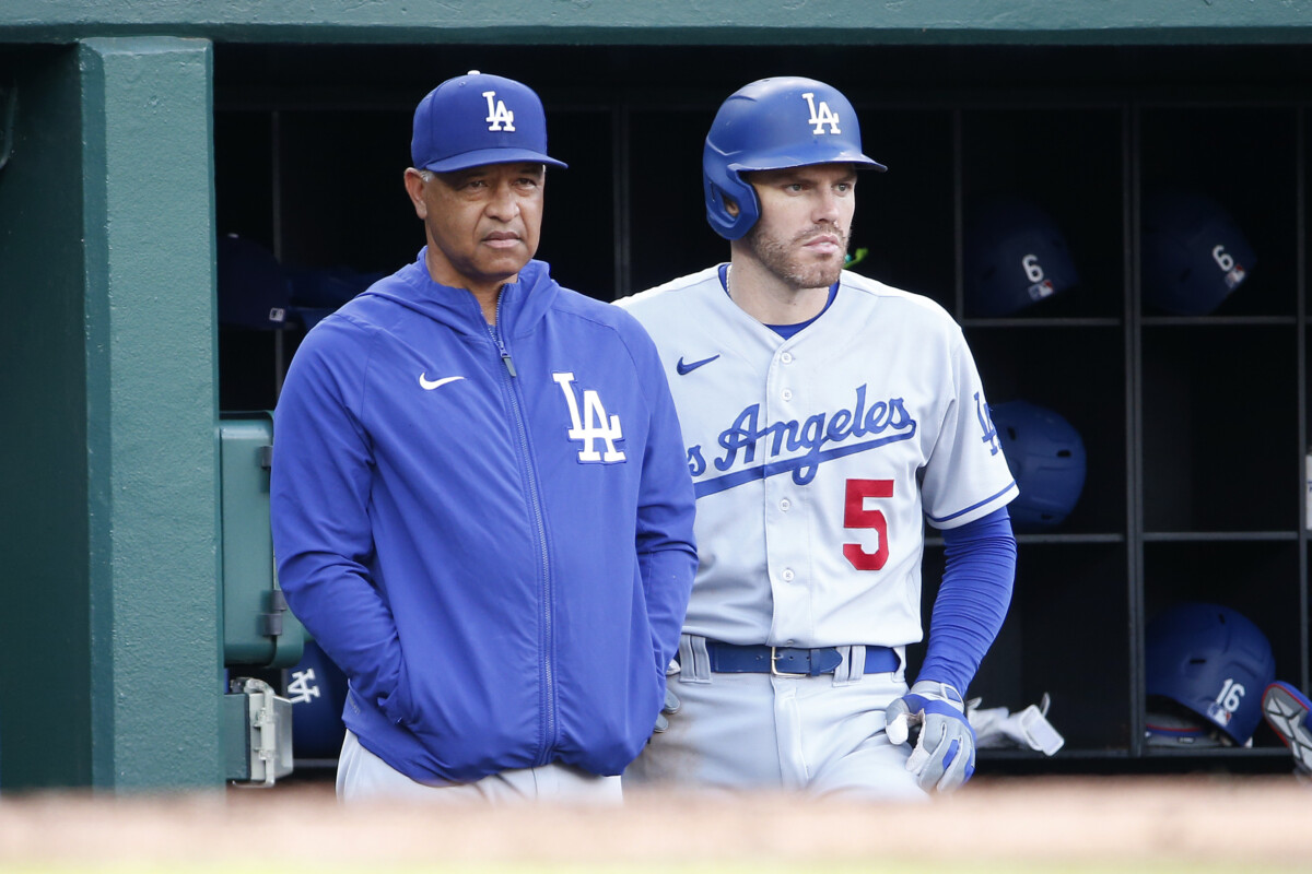 Sep 10, 2023; Washington, District of Columbia, USA; Los Angeles Dodgers manager Dave Roberts (30) and Dodgers first baseman Freddie Freeman (5) look on from the dugout durining the eighth inning against the Washington Nationals at Nationals Park. Mandatory Credit: Amber Searls-USA TODAY Sports