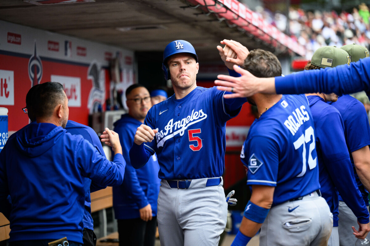 May 17, 2026; Anaheim, California, USA; Los Angeles Dodgers first baseman Freddie Freeman (5) is greeted by teammates after scoring during the fourth inning against the Los Angeles Angels at Angel Stadium. Mandatory Credit: William Liang-Imagn Images