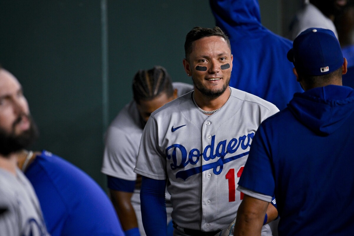 Miguel Rojas smiles in the Los Angeles Dodgers dugout