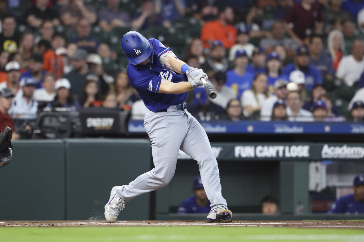 May 4, 2026; Houston, Texas, USA; Los Angeles Dodgers catcher Will Smith (16) hits a single during the first inning against the Houston Astros at Daikin Park. Mandatory Credit: Troy Taormina-Imagn Images
