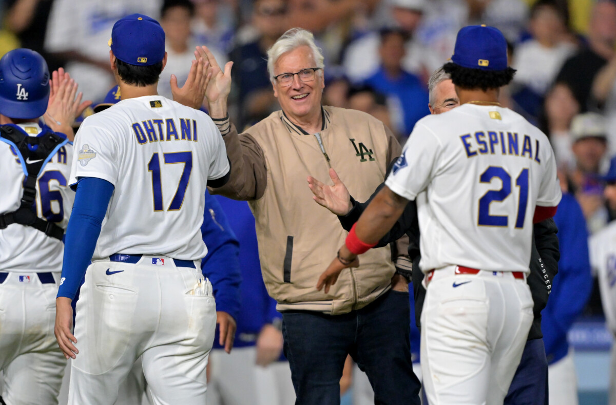 Mar 28, 2026; Los Angeles, California, USA; Los Angeles Dodgers owner Mark Walter celebrates with designated hitter Shohei Ohtani (17) and third baseman Santiago Espinal (21) after defeating the Arizona Diamondbacks at Dodger Stadium. Mandatory Credit: Jayne Kamin-Oncea-Imagn Images