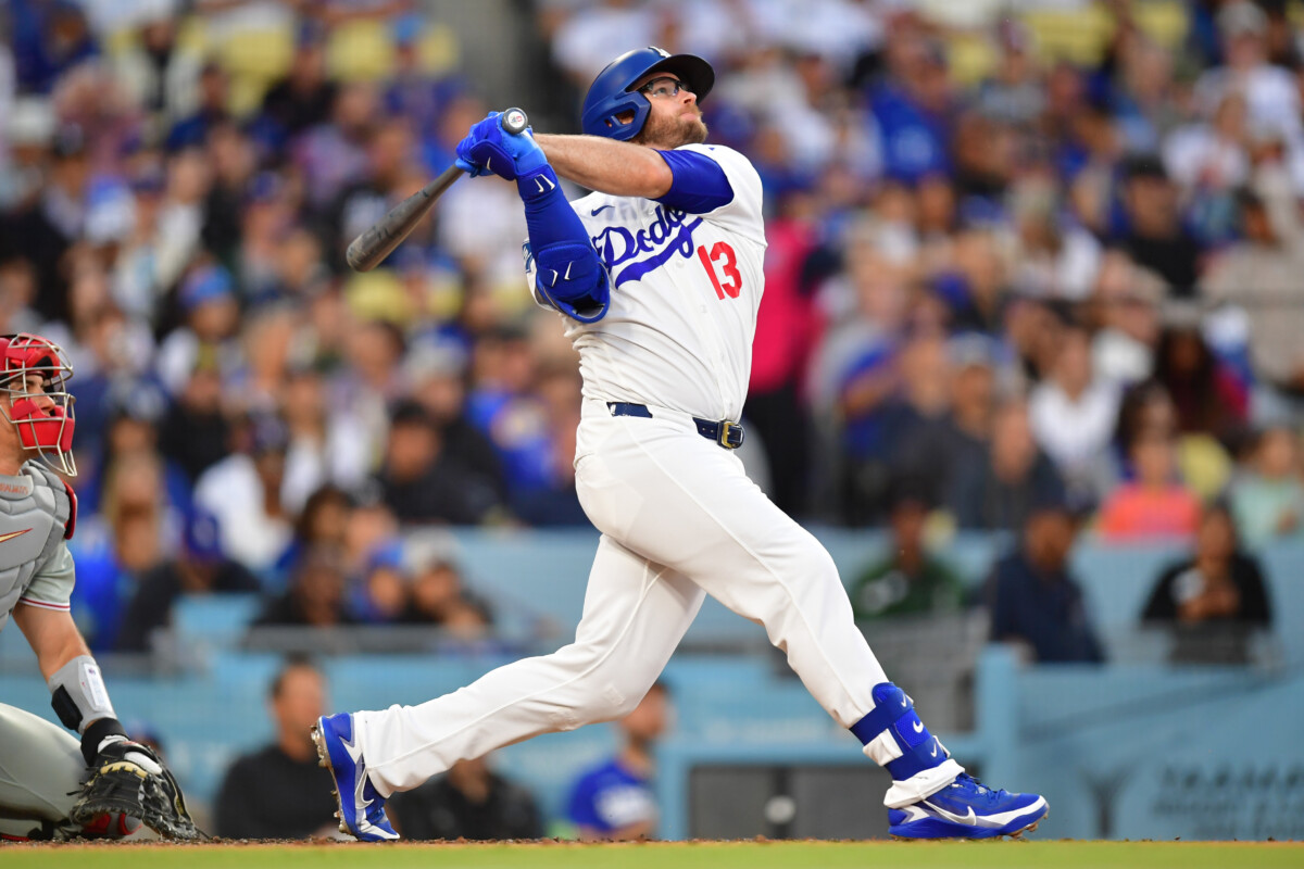 May 29, 2026; Los Angeles, California, USA; Los Angeles Dodgers third baseman Max Muncy (13) hits a home run against the Philadelphia Phillies in the second inning at Dodger Stadium. Mandatory Credit: Gary A. Vasquez-Imagn Images
