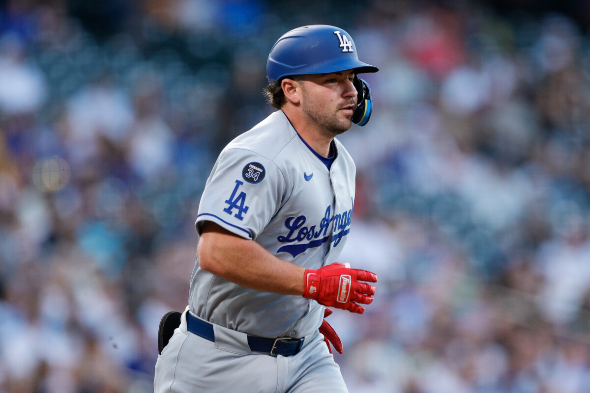 Aug 19, 2025; Denver, Colorado, USA; Los Angeles Dodgers third baseman Buddy Kennedy (46) runs to first on an RBI single advancing to second in the third inning against the Colorado Rockies at Coors Field. Mandatory Credit: Isaiah J. Downing-Imagn Images