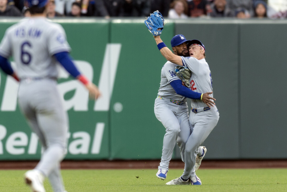 Apr 21, 2026; San Francisco, California, USA; Los Angeles Dodgers outfielder Teoscar Hernandez (37) and outfielder Alex Call (12) collide pursuing a shallow popup during the first inning against the San Francisco Giants at Oracle Park. Mandatory Credit: D. Ross Cameron-Imagn Images