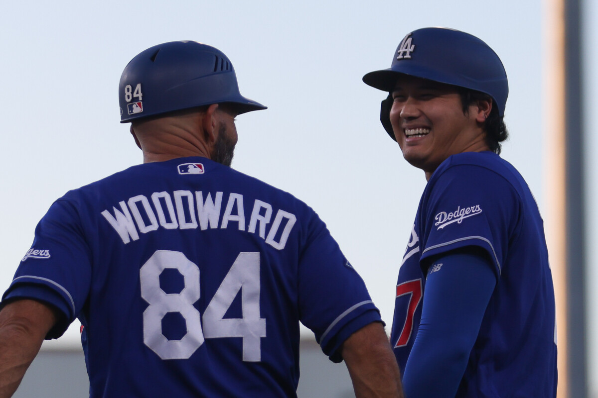 Jun 30, 2026; West Sacramento, California, USA; Los Angeles Dodgers designated hitter Shohei Ohtani, right, smiles after drawing a walk during the sixth inning against the Athletics at Sutter Health Park. Mandatory Credit: Scott Marshall-Imagn Images