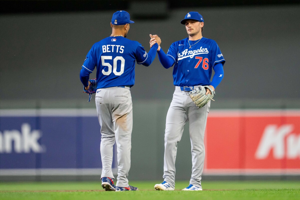 Jun 22, 2026; Minneapolis, Minnesota, USA; Los Angeles Dodgers shortstop Mookie Betts (50) shakes hands with Los Angeles Dodgers second baseman Alex Freeland (76) after defeating the Minnesota Twins at Target Field. Mandatory Credit: Jesse Johnson-Imagn Images