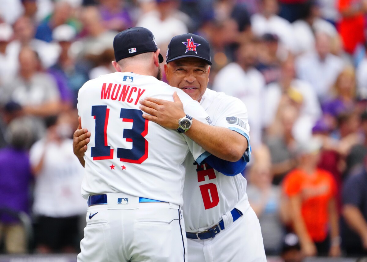 Jul 13, 2021; Denver, Colorado, USA; Los Angeles Dodgers first baseman Max Muncy greets manager Dave Roberts during the 2021 MLB All Star Game between the American League and the National League at Coors Field. Mandatory Credit: Mark J. Rebilas-USA TODAY Sports
