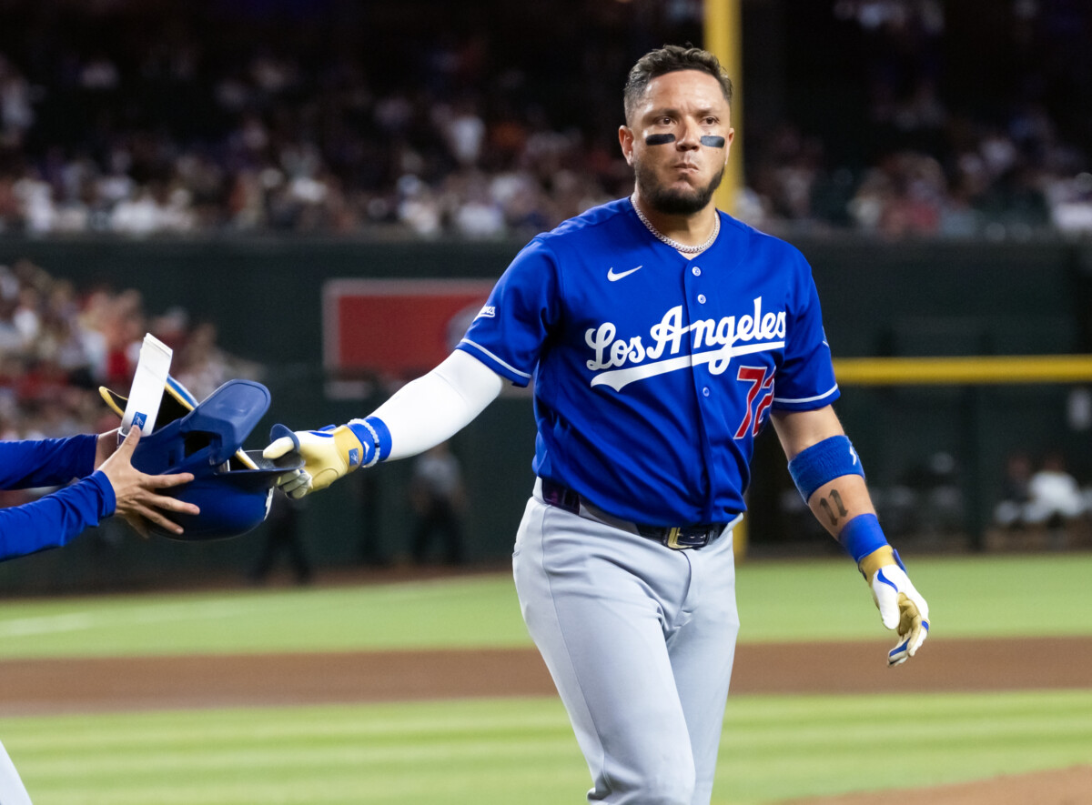 Jun 1, 2026; Phoenix, Arizona, USA; Los Angeles Dodgers batter Miguel Rojas reacts after being called out on strikes via ABS challenge in the fourth inning against the Arizona Diamondbacks at Chase Field. Mandatory Credit: Mark J. Rebilas-Imagn Images