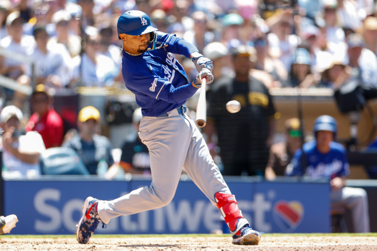 Jun 28, 2026; San Diego, California, USA; Los Angeles Dodgers shortstop Mookie Betts (50) hits a two-run single during the fifth inning against the San Diego Padres at Petco Park. Mandatory Credit: David Frerker-Imagn Images