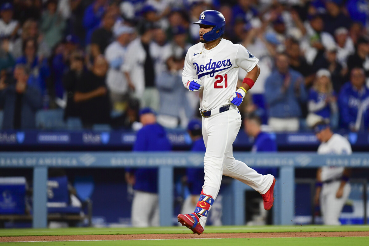 May 13, 2026; Los Angeles, California, USA; Los Angeles Dodgers third baseman Santiago Espinal (21) hits a solo home run in the third inning against the San Francisco Giants at Dodger Stadium. Mandatory Credit: Gary A. Vasquez-Imagn Images