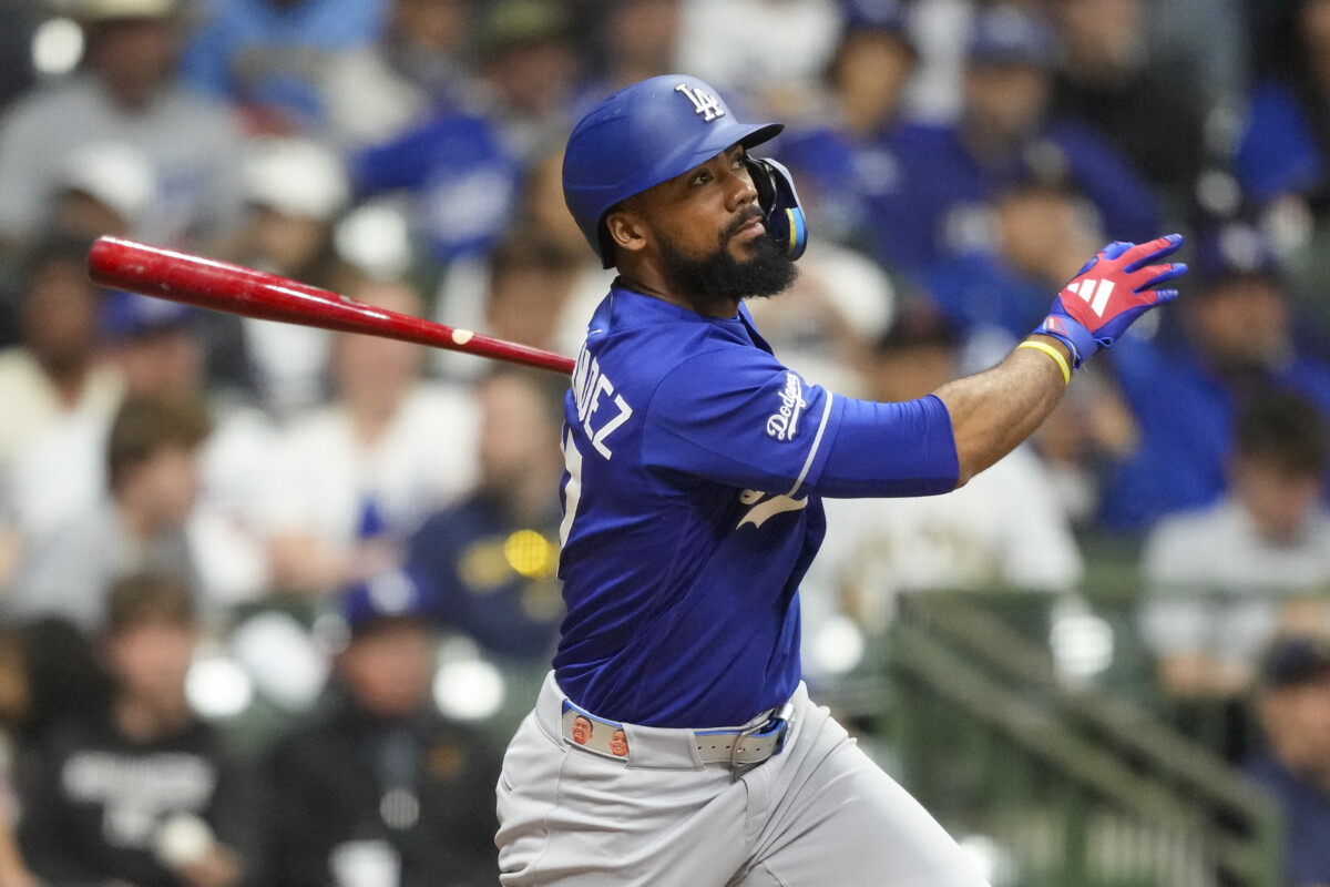 May 23, 2026; Milwaukee, Wisconsin, USA; Los Angeles Dodgers left fielder Teoscar Hernandez (37) hits an RBI single during the ninth inning against the Milwaukee Brewers at American Family Field. Mandatory Credit: Jeff Hanisch-Imagn Images