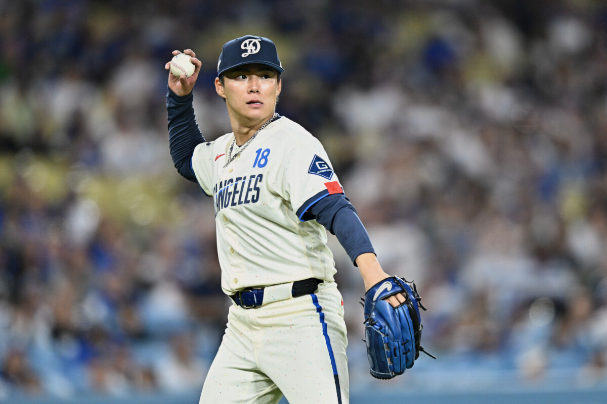 Jun 6, 2026; Los Angeles, California, USA; Los Angeles Dodgers starting pitcher Yoshinobu Yamamoto (18) throws the ball to first base for an out after fielding a ground ball hit by Los Angeles Angels infielder Nolan Schanuel (not pictured) during the seventh inning at Dodger Stadium. Mandatory Credit: William Liang-Imagn Images