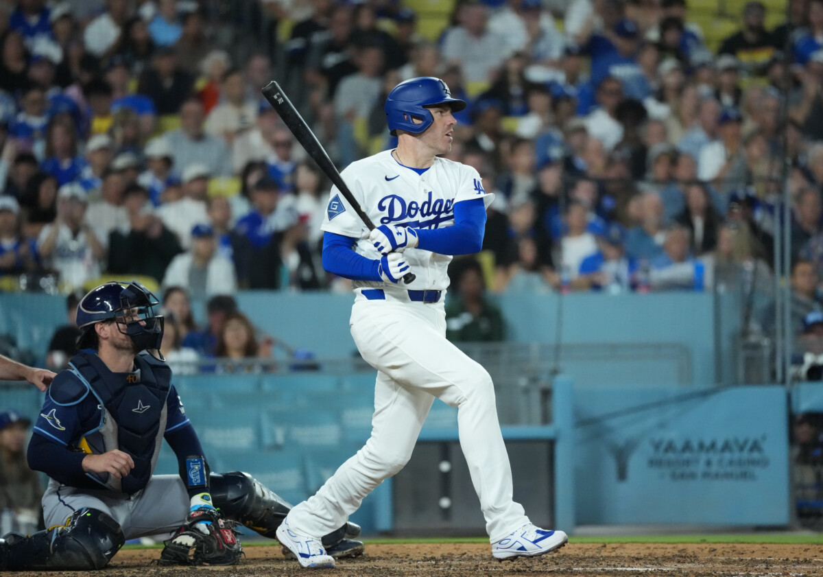Jun 16, 2026; Los Angeles, California, USA; Los Angeles Dodgers first baseman Freddie Freeman (5) hits a single during the sixth inning against the Tampa Bay Rays at Dodger Stadium. Mandatory Credit: Kirby Lee-Imagn Images