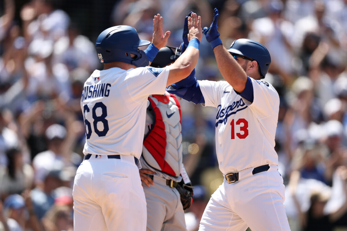 Jun 22, 2025; Los Angeles, California, USA; Los Angeles Dodgers third baseman Max Muncy (13) celebrates with catcher Dalton Rushing (68) after hitting a grand slam during the sixth inning against the Washington Nationals at Dodger Stadium. Mandatory Credit: Kiyoshi Mio-Imagn Images