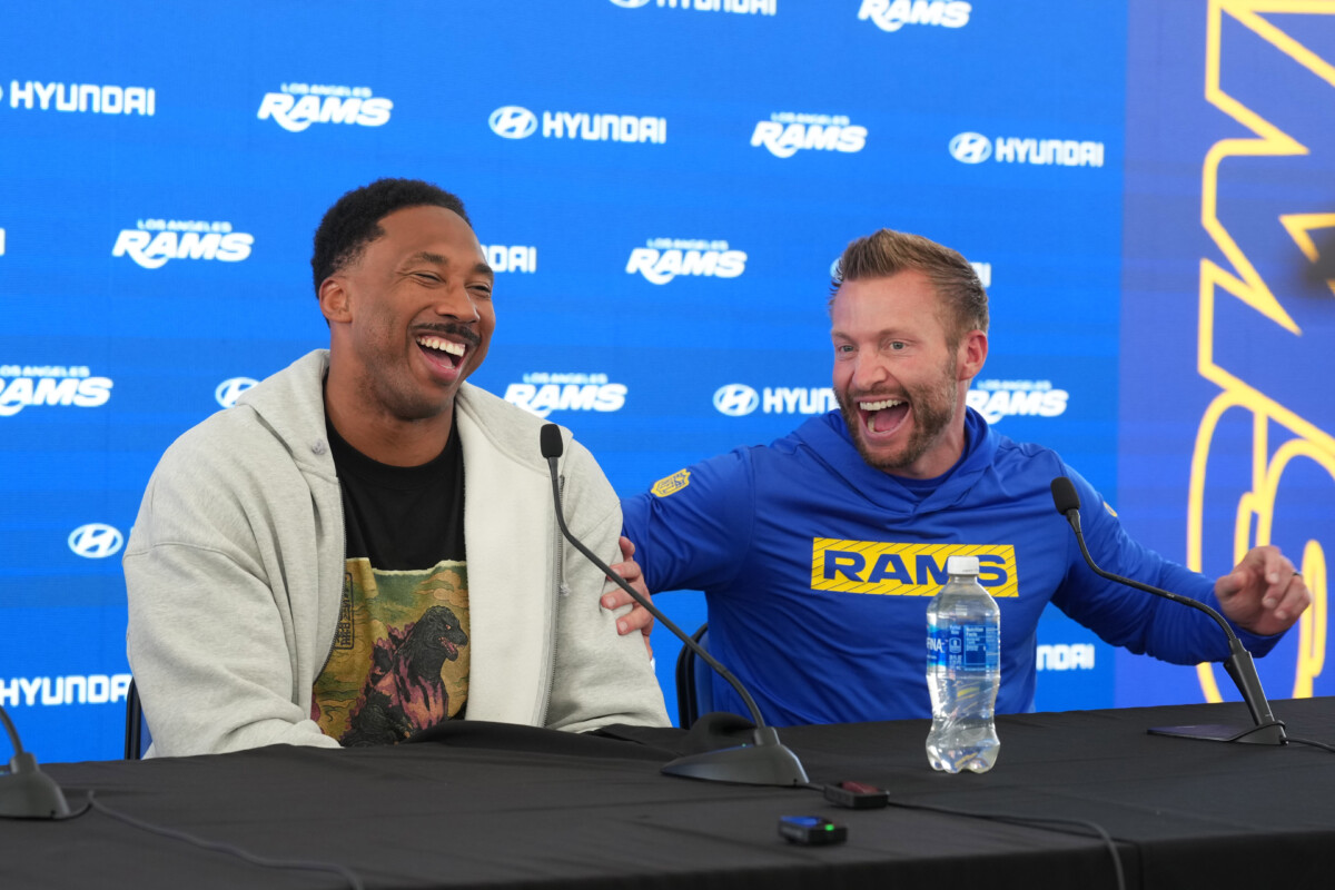 Jun 2, 2026; Woodland Hills, CA, USA; Los Angeles Rams defensive end Myles Garrett (left) and coach Sean McVay react during press conference at Rams Practice Facility. Mandatory Credit: Kirby Lee-Imagn Images