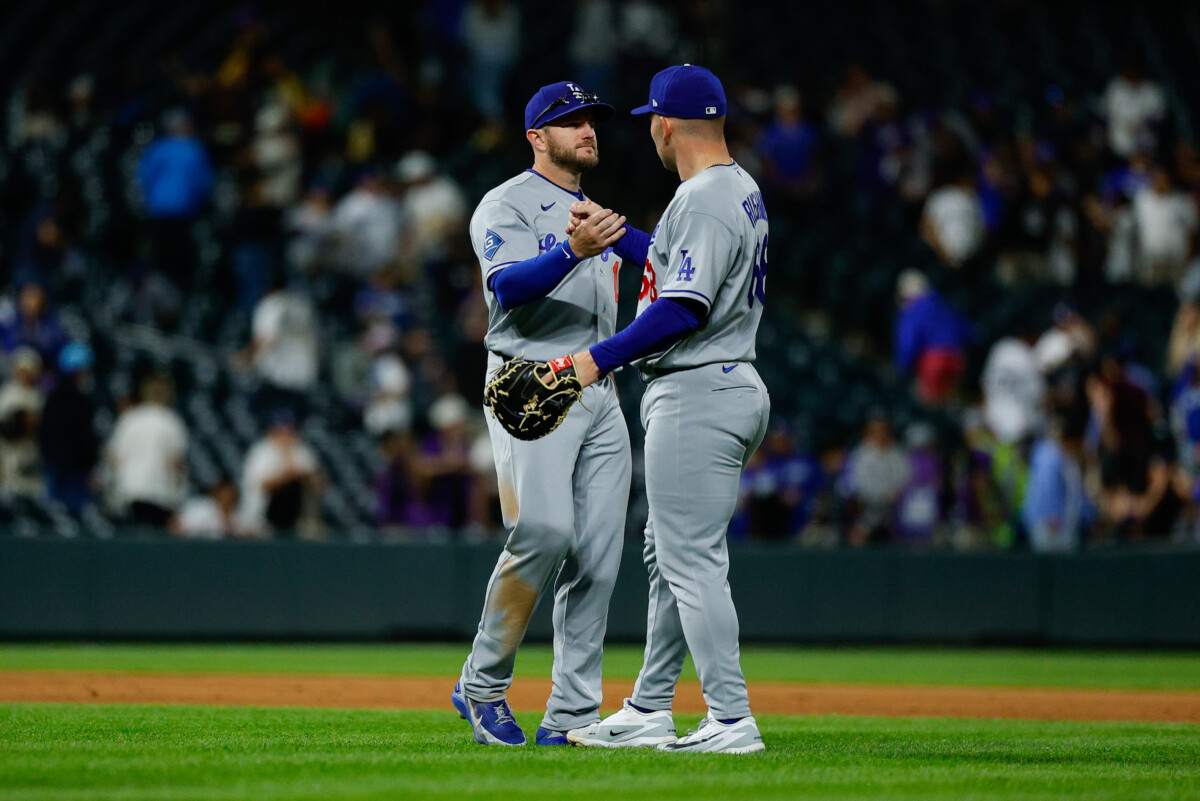 Apr 20, 2026; Denver, Colorado, USA; Los Angeles Dodgers third baseman Max Muncy (13) celebrates with first baseman Dalton Rushing (68) after the game against the Colorado Rockies at Coors Field. Mandatory Credit: Isaiah J. Downing-Imagn Images