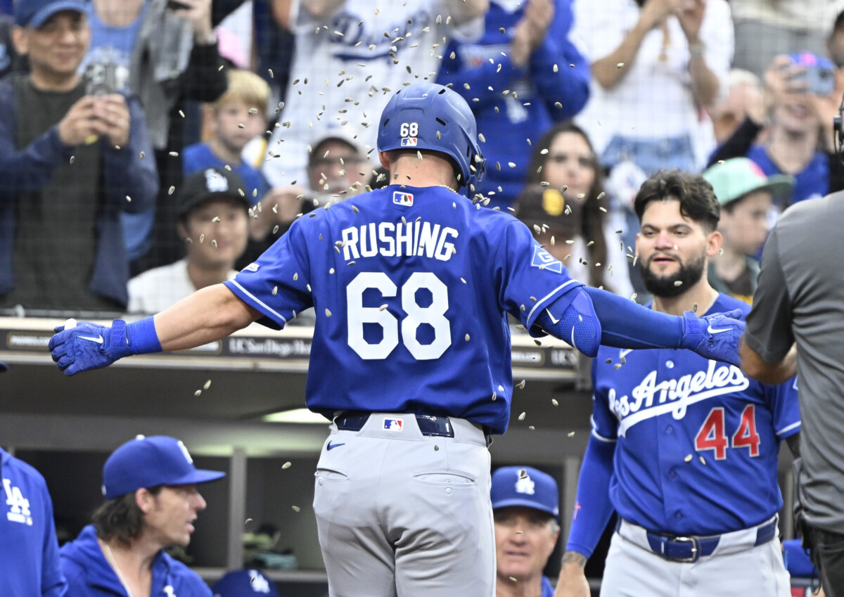 Jun 27, 2026; San Diego, California, USA; Los Angeles Dodgers catcher Dalton Rushing (68) is welcomed into the dugout after hitting a solo home run during the sixth inning against the San Diego Padres at Petco Park. Mandatory Credit: Denis Poroy-Imagn Images