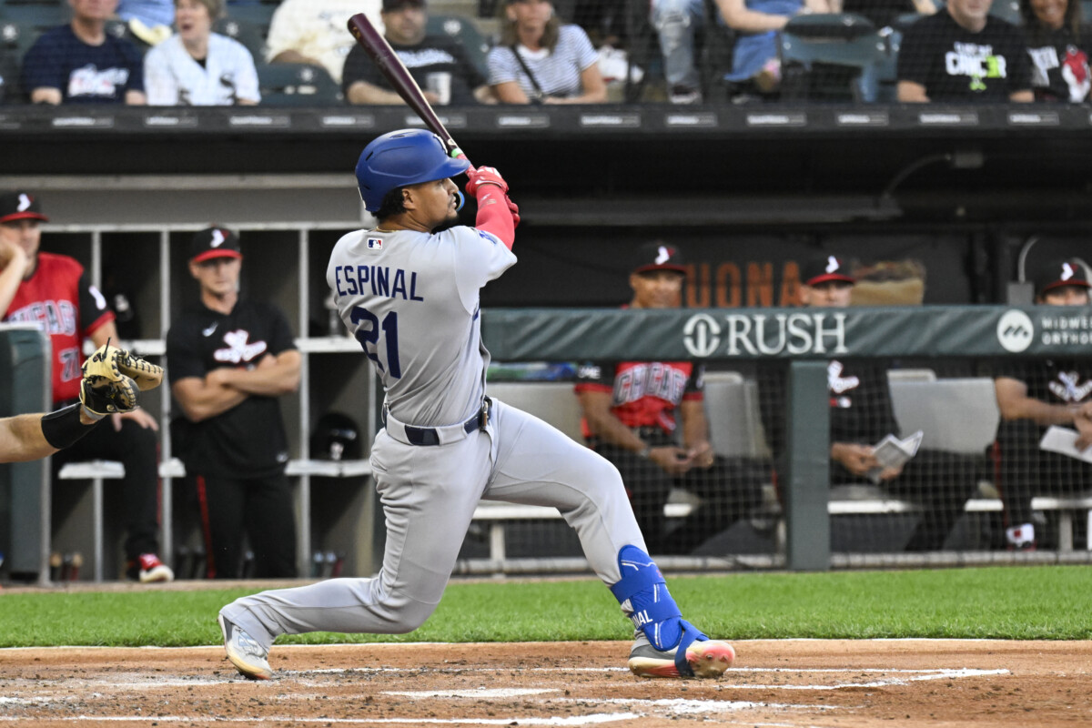 Jun 12, 2026; Chicago, Illinois, USA; Los Angeles Dodgers third baseman Santiago Espinal (21) hits a two RBI single against the Chicago White Sox during the second inning at Rate Field. Mandatory Credit: Matt Marton-Imagn Images