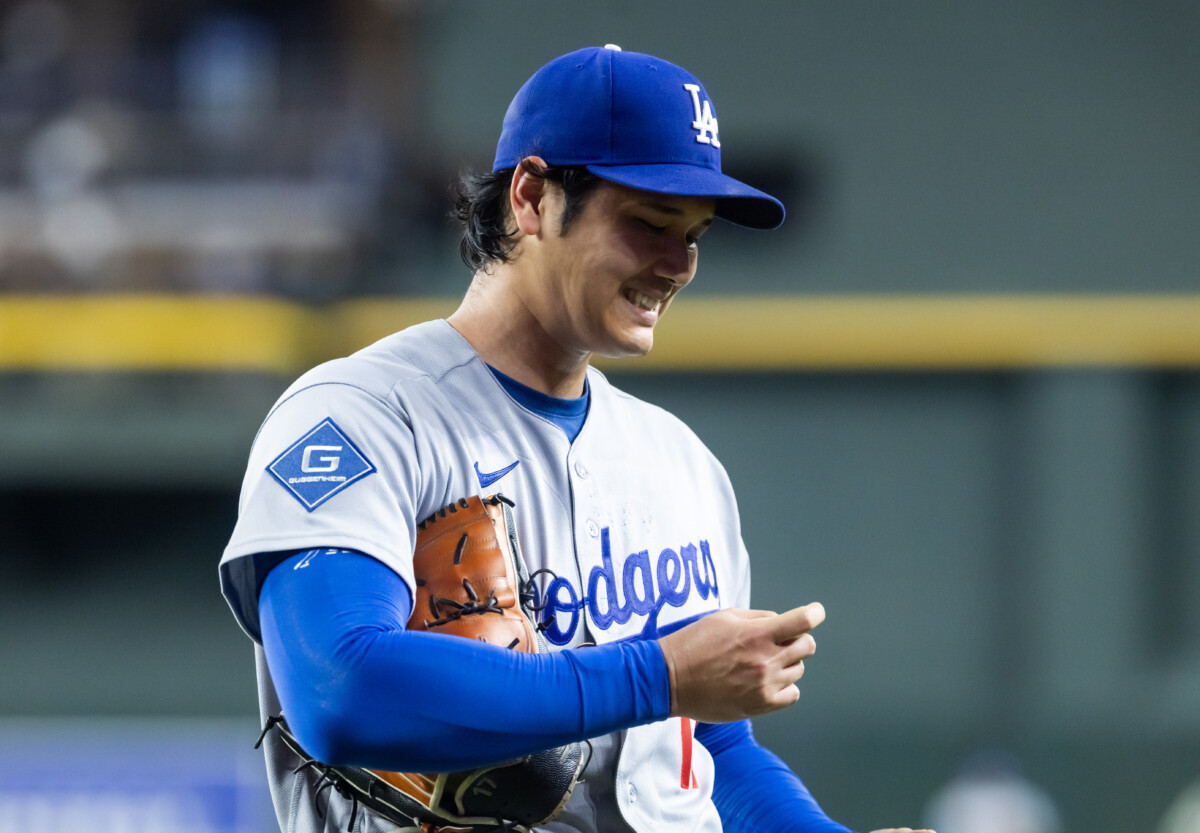 Jun 3, 2026; Phoenix, Arizona, USA; Los Angeles Dodgers pitcher Shohei Ohtani reacts as he looks at his finger in the third inning against the Arizona Diamondbacks at Chase Field. Mandatory Credit: Mark J. Rebilas-Imagn Images