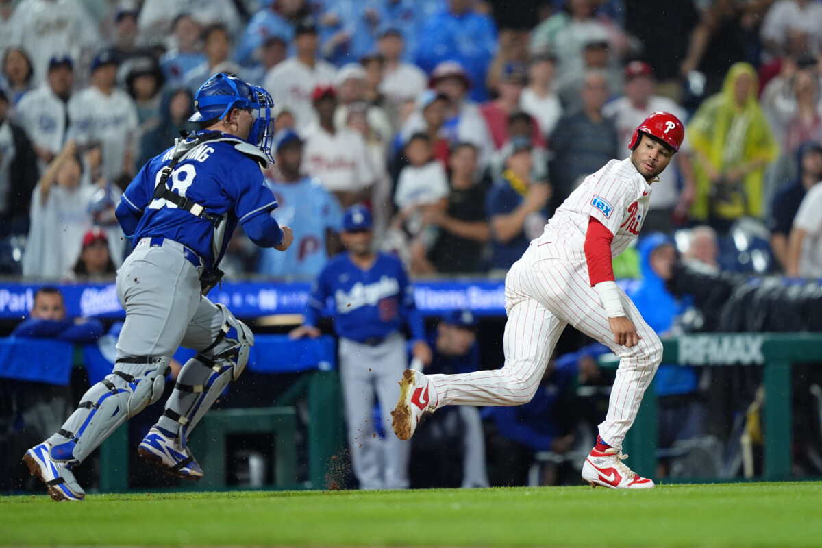 Jul 21, 2026; Philadelphia, Pennsylvania, USA; Philadelphia Phillies outfielder Justin Crawford (2) is caught in a rundown against Los Angeles Dodgers catcher Dalton Rushing (68) in the ninth inning at Citizens Bank Park. Mandatory Credit: Kyle Ross-Imagn Images