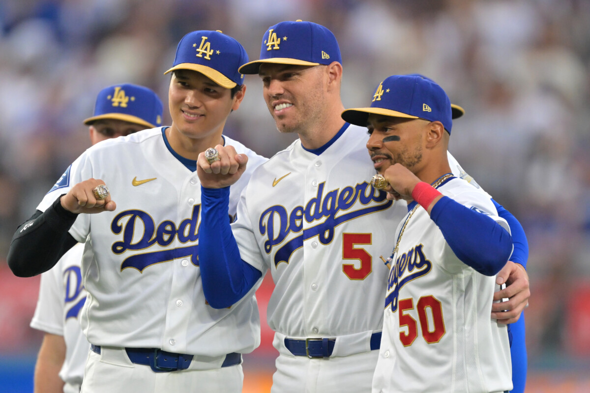 Mar 27, 2026; Los Angeles, California, USA; Los Angeles Dodgers two-way player Shohei Ohtani (17) poses with first baseman Freddie Freeman (5) and shortstop Mookie Betts (50) during the World Series ring ceremony before the game against the Arizona Diamondbacks at Dodger Stadium. Mandatory Credit: Jayne Kamin-Oncea-Imagn Images