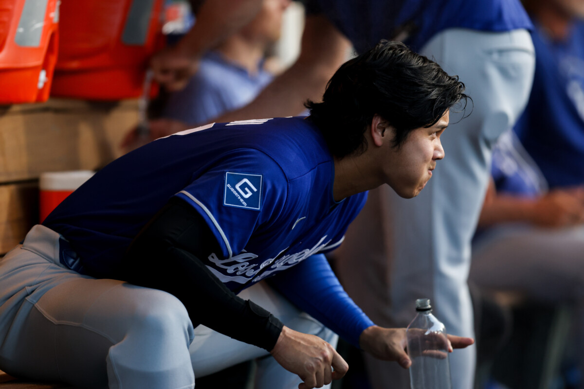 Jul 1, 2026; West Sacramento, California, USA; Los Angeles Dodgers designated hitter Shohei Ohtani (17) stretches in the dugout during the fourth inning against the Athletics at Sutter Health Park. Mandatory Credit: Sergio Estrada-Imagn Images